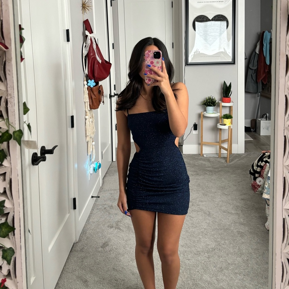 Windsor sparky deep blue mini dress with a cutout on the back. Never been worn!
